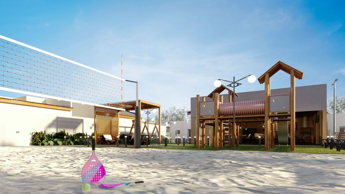 Quadra de areia do Vila Oásis, com rede de vôlei, playground e espaço gourmet ao fundo